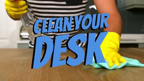 animation of clean your desk text over mid section of biracial man cleaning desk