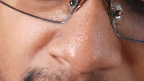 close-up of a man's nose and glasses