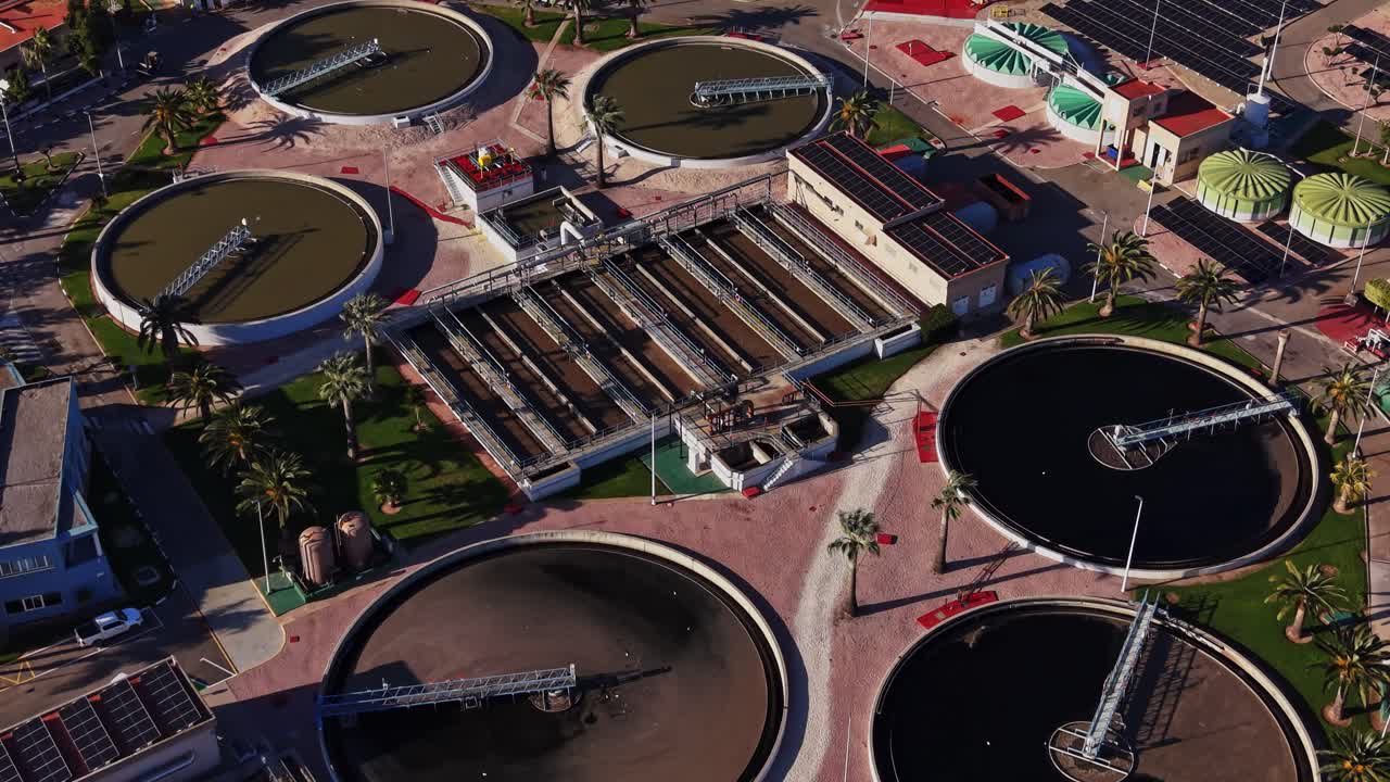 Wastewater treatment plant in Spain shows circular tanks and equipment