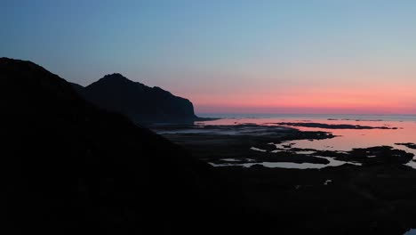 aerial shot of lofoten countryside in norway during blue hour sunset