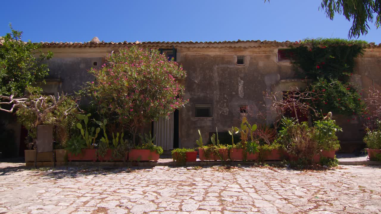 Scopello city center in Sicilia with rustic charm and sunny ambiance