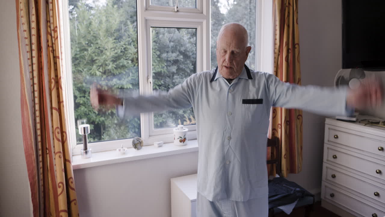 Elderly man exercising in bedroom