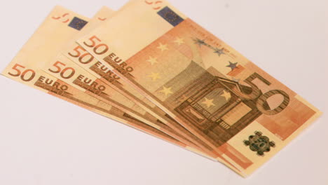 fifty euro banknotes falling in super slow motion