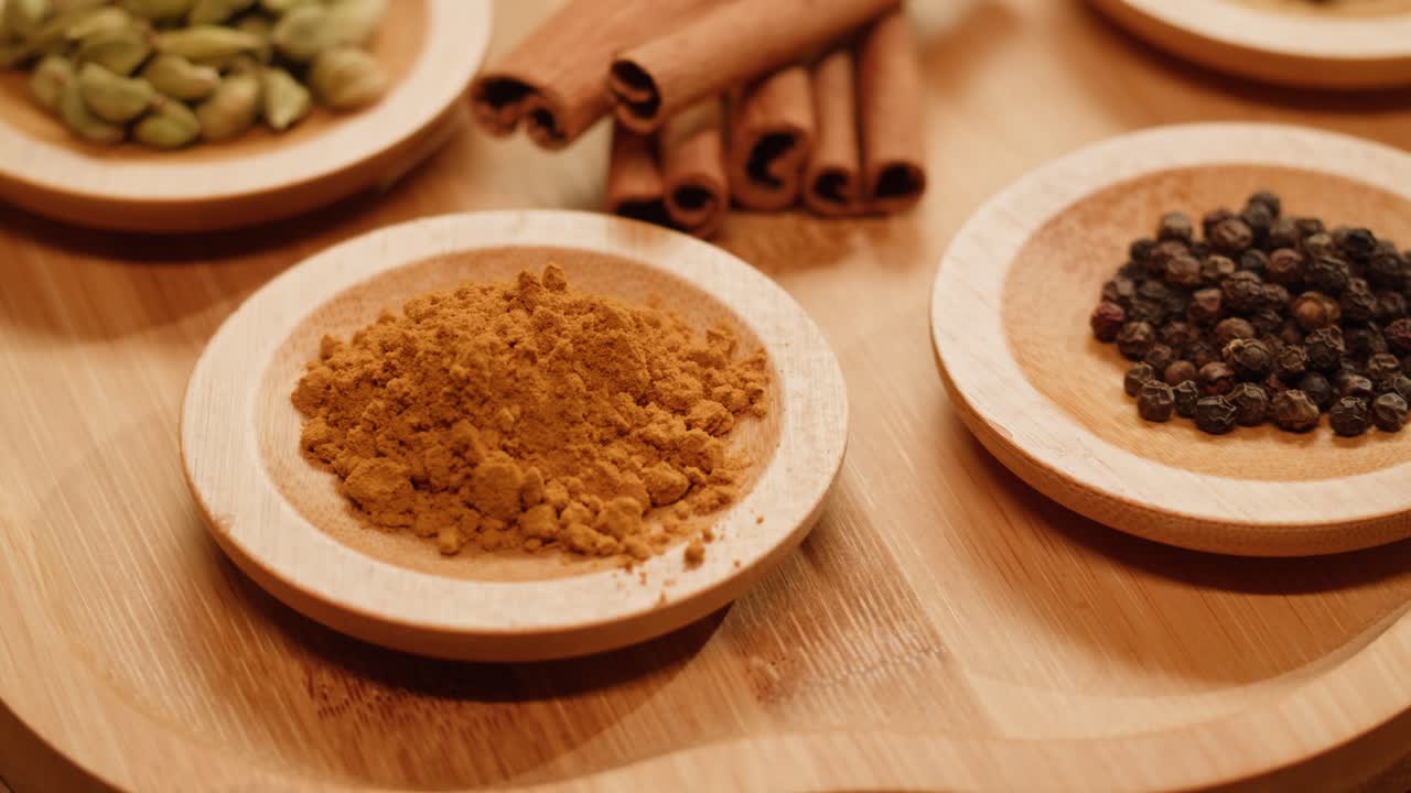 Assortment of Spices on Wooden Plates