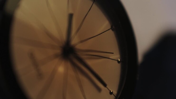 A close up shot of the second hand on a watch ticking