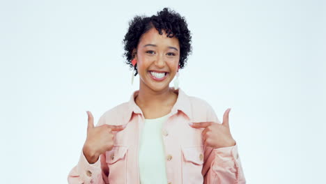 face, smile and woman with hand pointing in studio