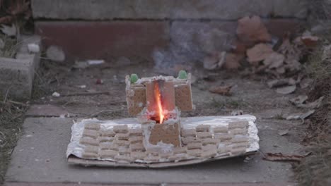 an m80 in a gingerbread toilet and bathroom lit in the toilet and it eventually explodes