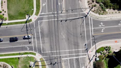 top view of an intersection with daytime traffic on a sunny day