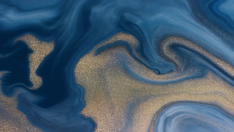abstract fluid art with blue and gold shimmer