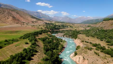 Bird's-Eye-View-Of-The-Narrow-Waterscape-Of-Pskem-River-At-The-Mountain-Range-In-Uzbekistan