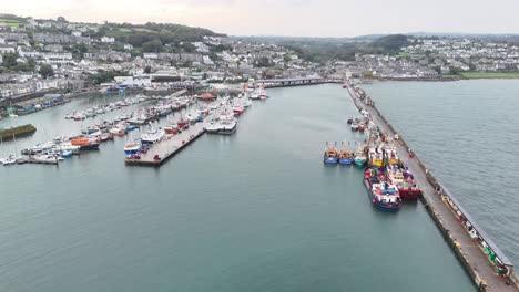 Ascending-drone,aerial--Newlyn-harbour-Cornish-fishing-port-UK