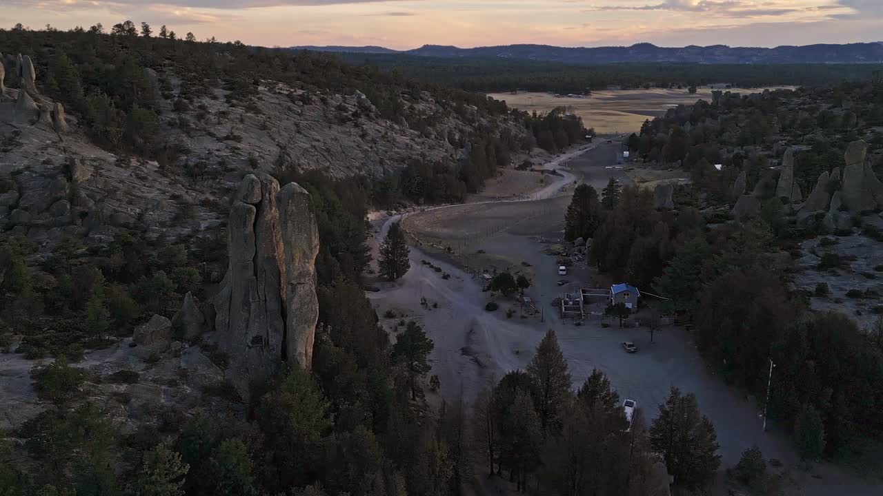 Majestic rock formations in Creel’s Valle de los Monjes at dusk, serene mountain view