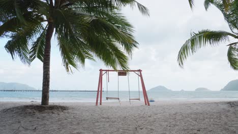 Empty-Swing-Stands-Near-The-Shore-Of-An-Hai-Beach-At-Con-Dao-In-Vietnam