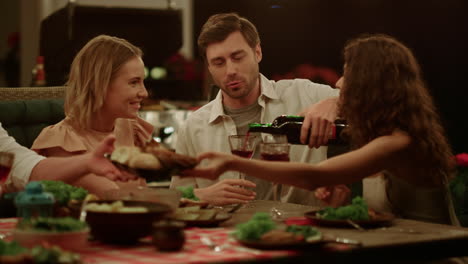 Friends-enjoying-outdoor-dinner-on-backyard.-Man-flirting-with-women