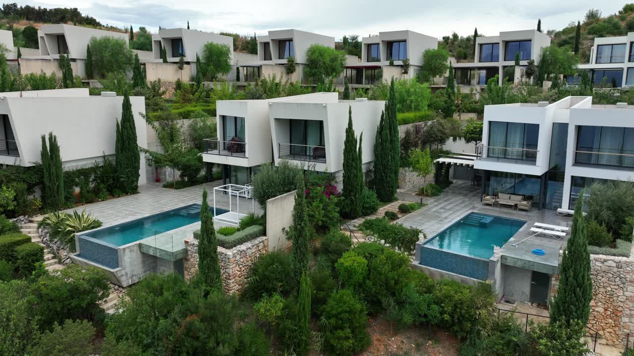 Saranda, Vlorë, Albania - Modern Hillside Villas With Private Pools and Lush Mediterranean Gardens - Orbit Drone Shot