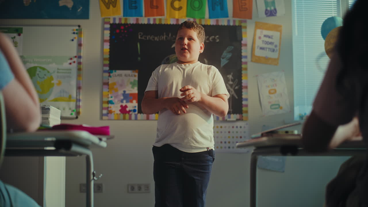 STEM Class Shy Elementary School Boy Presenting Homework on Ecology in Front of Classmates