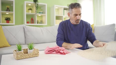 Cheerful-and-pleasant-mature-man-cleaning-house.