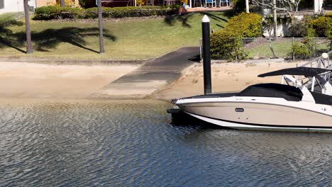 a boat docking at a canal in gold coast