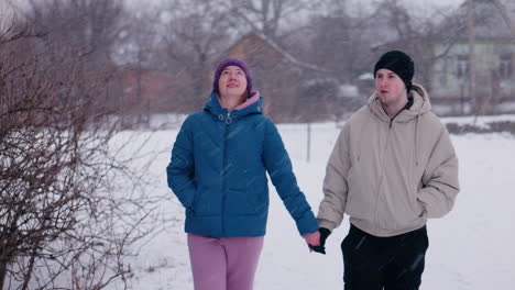 couple walking in the snow