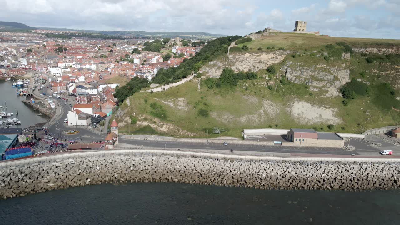 Aerial bird's eye view of Scarborough harbor and castle