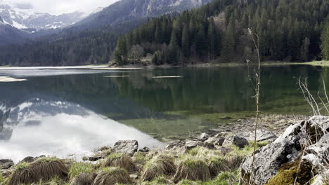 obersee in the glarus alps and water reflection on it, glarnerland, näfels, canton of glarus, switzerland