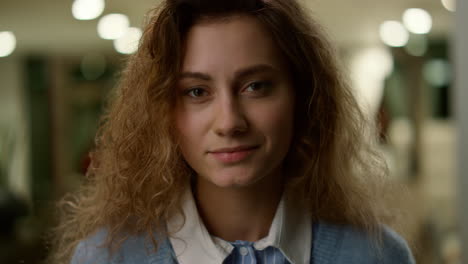 serious businesswoman face. female student posing at camera in office