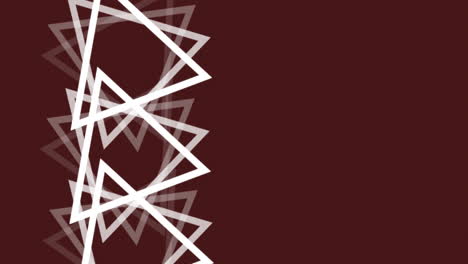 animation of multiple white triangles spinning on seamless loop over brown background