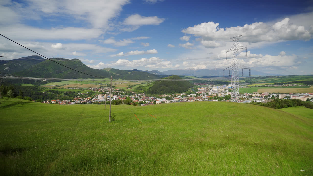 Green Valley Overlooking Ruzomberok Historical Townscape In Liptov Region, Slovakia. Wide Shot