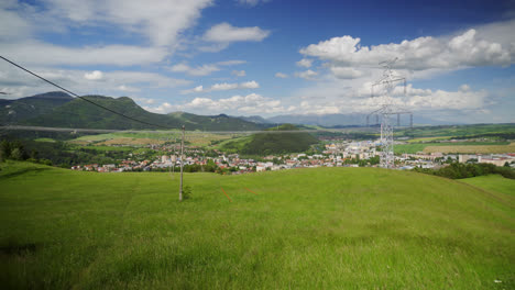 green valley overlooking ruzomberok historical townscape in liptov region, slovakia. wide shot