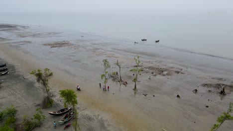 kuakata sea beach small wooden fishing boats and trawlers from lebur char, bangladesh