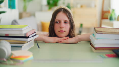 a young girl terrified of the amount of studying and books to read for a school test