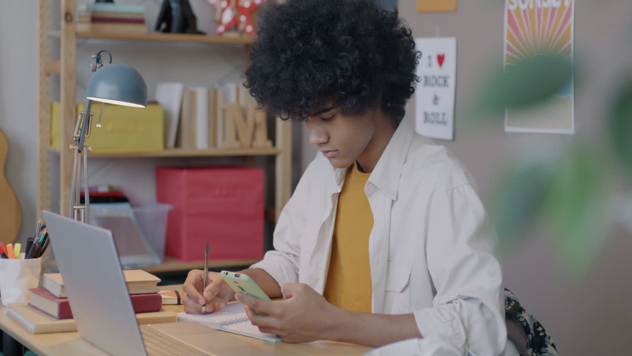 Teenager studying at home