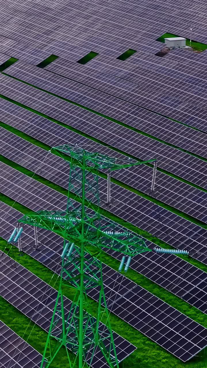 Top view of a solar field, green nature on the background