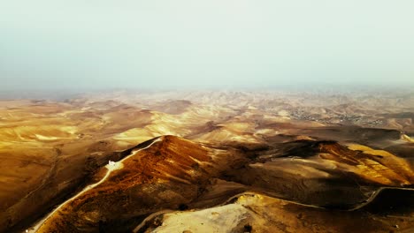 extreme brown dry desert, dust and haze to the end of the horizon, saturated brown color