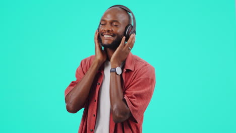 Headphones,-music-and-black-man-isolated-on-a-blue