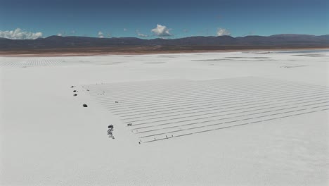 aerial landscape of the entire area of the salinas grande salt flat visited by tourists