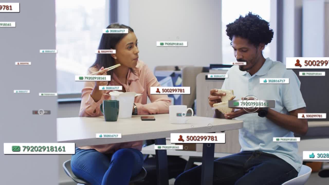Pair eating at work, time passing causing floating UI labels around them showing metrics smiling