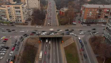 aerial timelapse of the cars passing by on a highway and a bridge