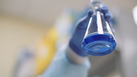 scientist mixing solution in lab