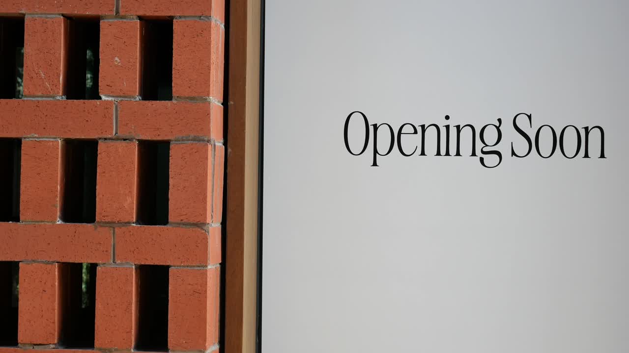 Opening Soon Sign on Building
