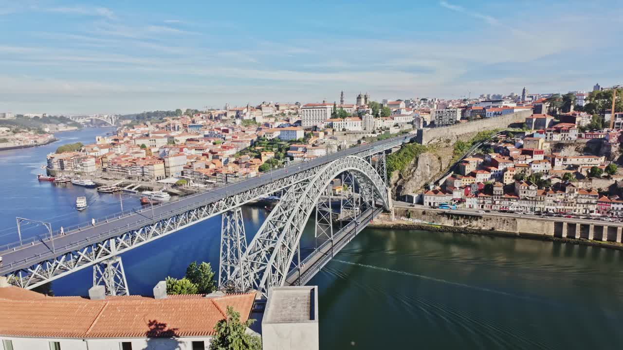 Porto, portugal, with dom luís i bridge crossing the douro river on a sunny day, aerial view