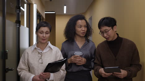 business meeting in office corridor