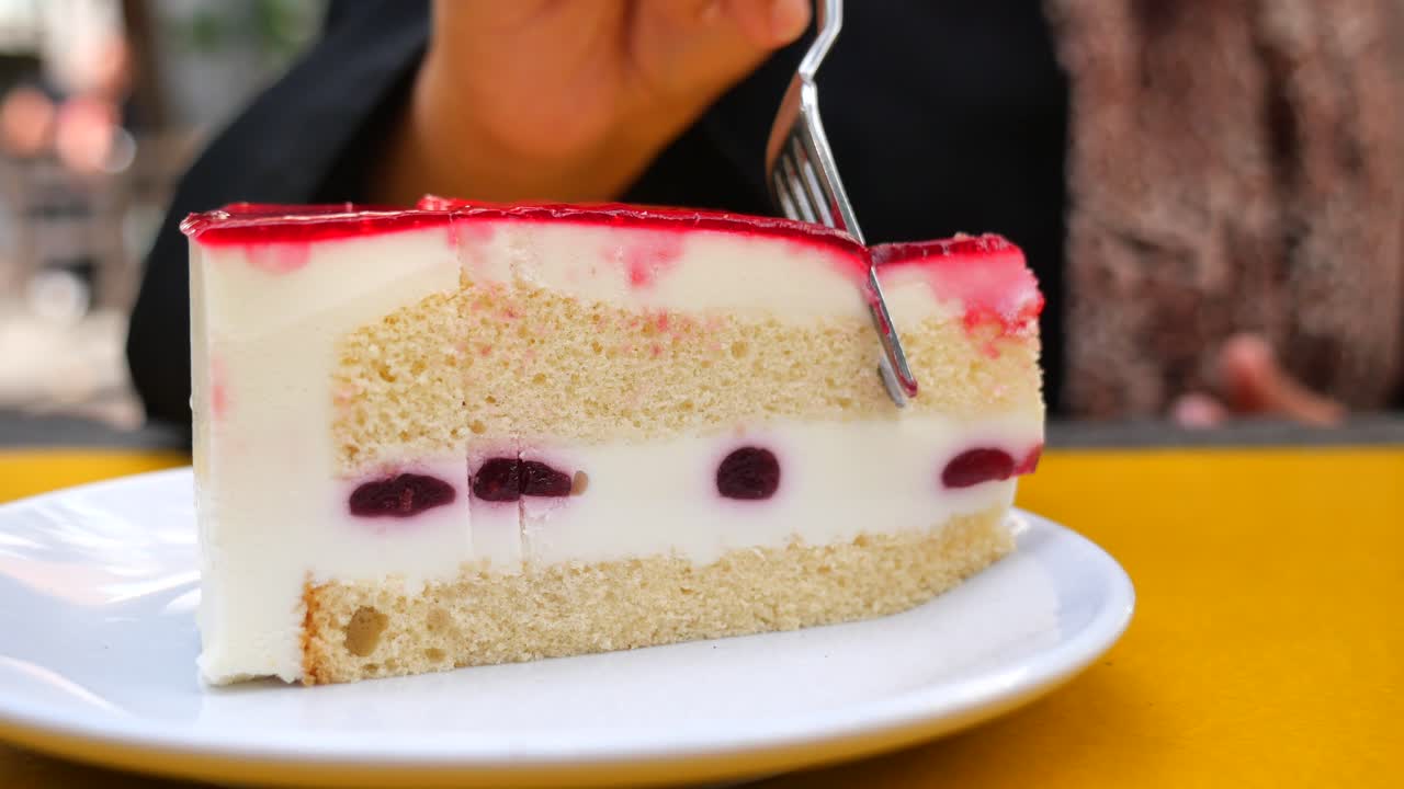 A slice of delicious cherry cake with jelly topping