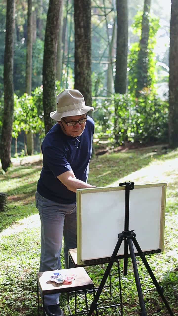 Talented artist painting outdoors amidst serene forest while capturing nature's beauty