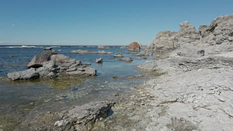 rocky coastline and calm clear waters of gotland, sweden