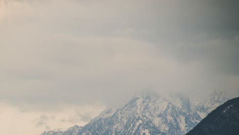 Timelpase-of-Large-Snowy-Alpine-Mountain-with-Clouds-Moving