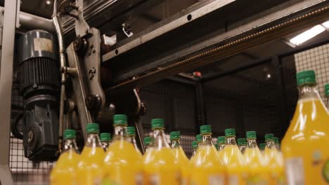 machine separating juice bottles