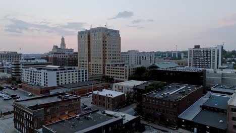 Downtown-Davenport,-Iowa-with-drone-video-moving-up-at-dusk