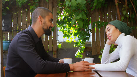 couple interacting with each other in cafeteria 4k
