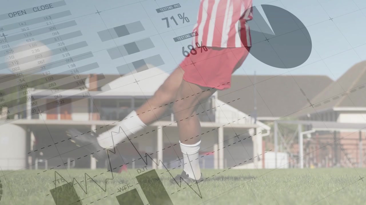 Male soccer player approaching ball, planting foot and kicking while showing sports stats charts